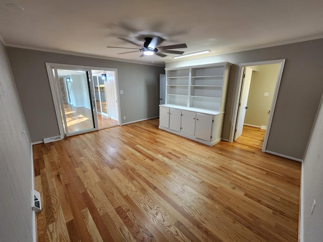 interior space featuring ceiling fan, light wood-type flooring, crown molding, and access to outside