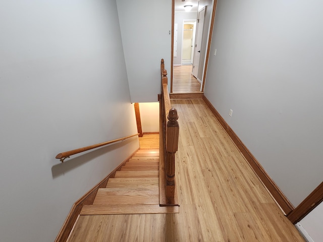 stairway featuring hardwood / wood-style floors