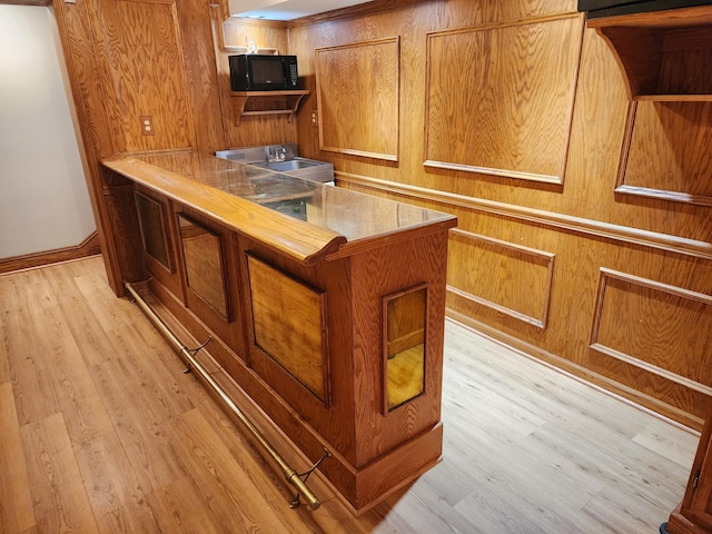 kitchen with a center island, wooden counters, and light hardwood / wood-style flooring