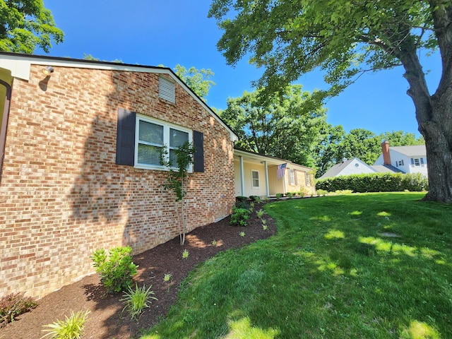 view of property exterior featuring a lawn