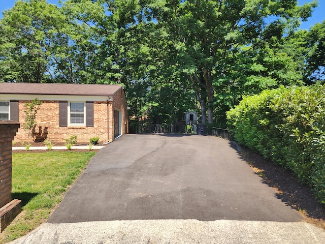 view of front facade featuring a garage and a front lawn