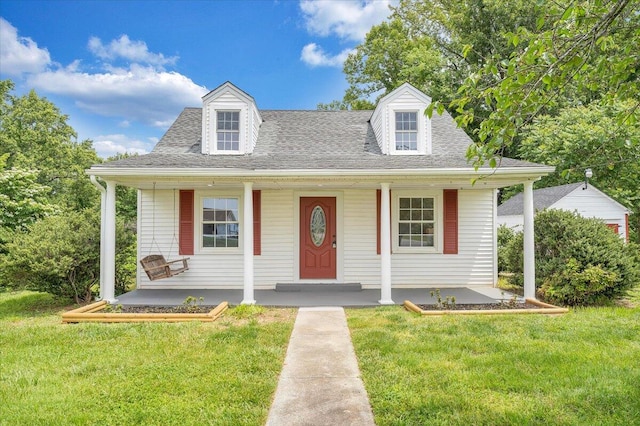 view of front of house with a front lawn and a porch