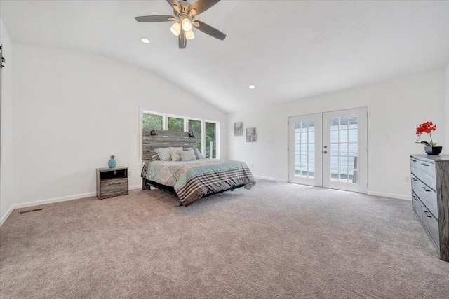 bedroom with a barn door, lofted ceiling, ceiling fan, and light colored carpet