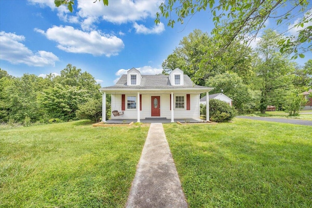 cape cod home featuring a front yard and a porch