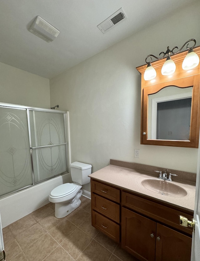 full bathroom with tile flooring, combined bath / shower with glass door, vanity, and toilet