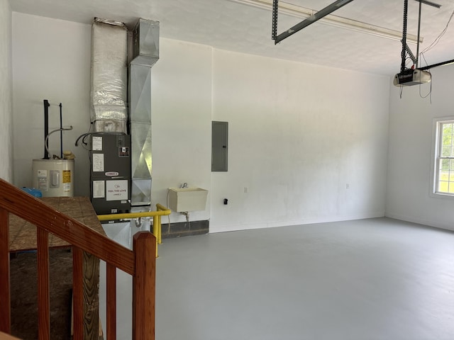 garage featuring sink, a garage door opener, and electric water heater