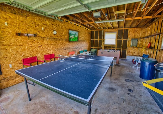 game room featuring concrete floors