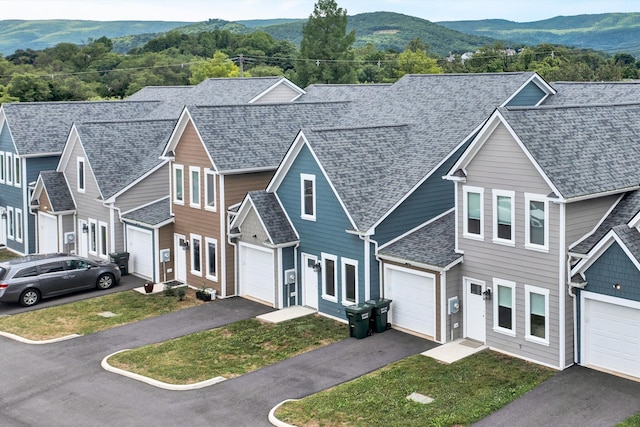 view of front of house featuring a mountain view and a garage