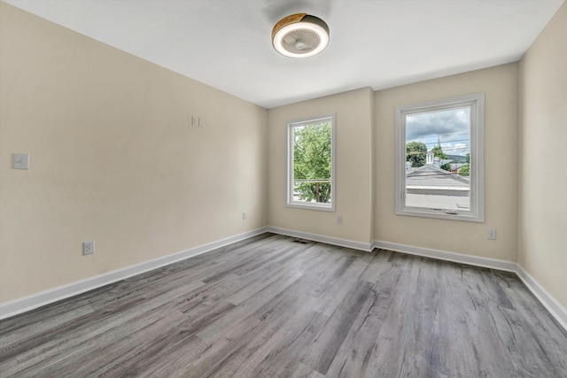 spare room featuring light wood-type flooring