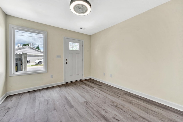 foyer entrance with light wood-type flooring