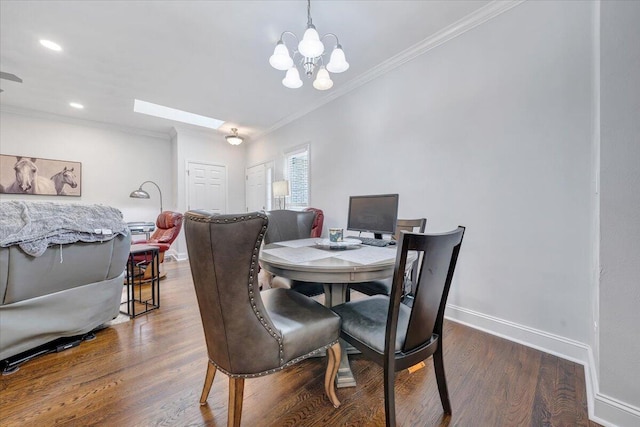 dining area with a chandelier, dark hardwood / wood-style floors, and ornamental molding