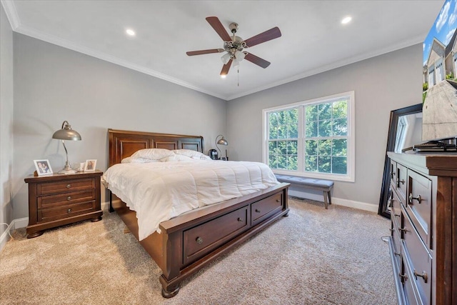 bedroom with light colored carpet, ceiling fan, and crown molding