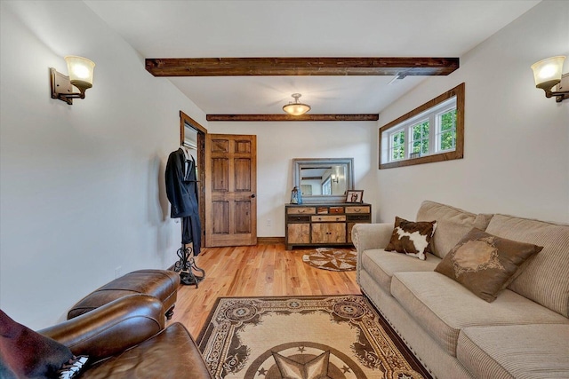 living room with beamed ceiling and hardwood / wood-style flooring