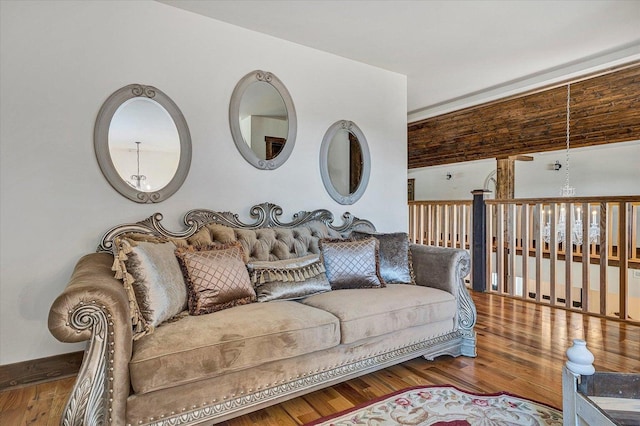 living room with a chandelier and wood-type flooring