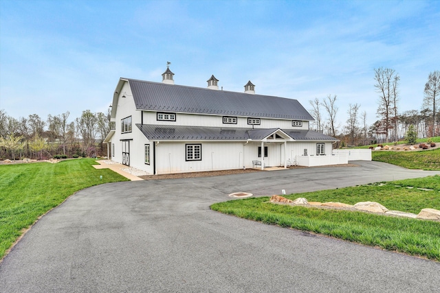 rear view of house with a lawn