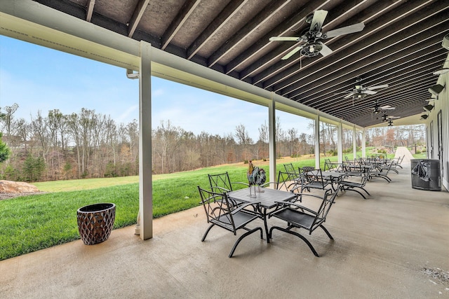 view of patio with a ceiling fan and outdoor dining space