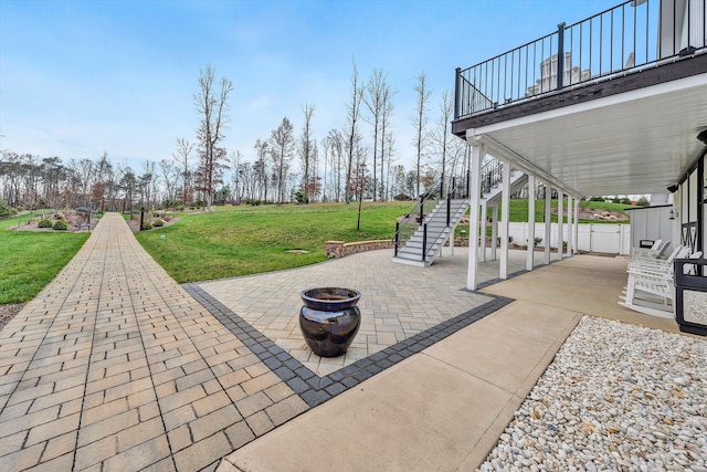 view of terrace with an outdoor fire pit