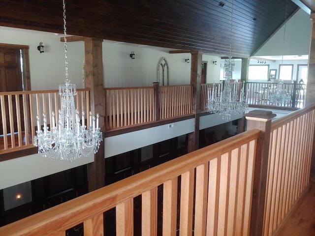 interior space featuring high vaulted ceiling and an inviting chandelier