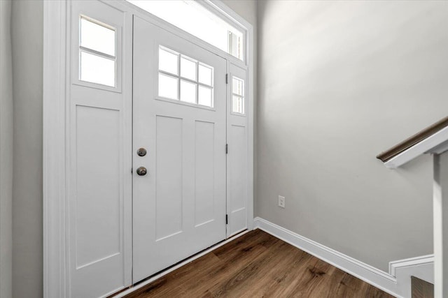 entrance foyer with dark hardwood / wood-style floors