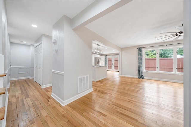 interior space with baseboards, visible vents, a ceiling fan, light wood-style floors, and recessed lighting