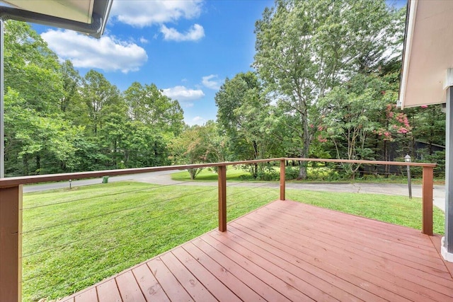 wooden terrace with a yard