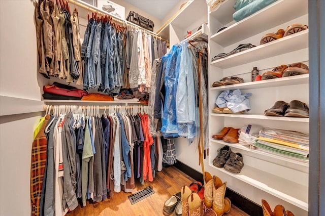 walk in closet featuring hardwood / wood-style floors