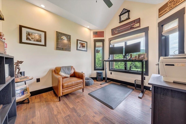 interior space with wood-type flooring, high vaulted ceiling, and ceiling fan