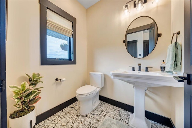 bathroom with tile patterned flooring and toilet