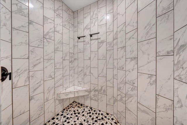 bathroom with tiled shower