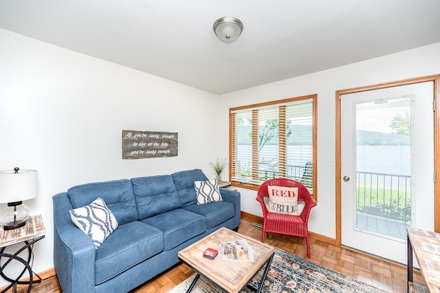 living room with plenty of natural light and parquet flooring