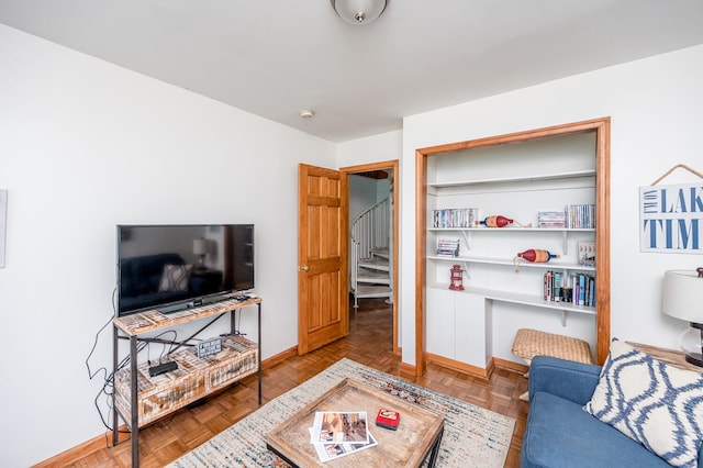 living room featuring parquet flooring