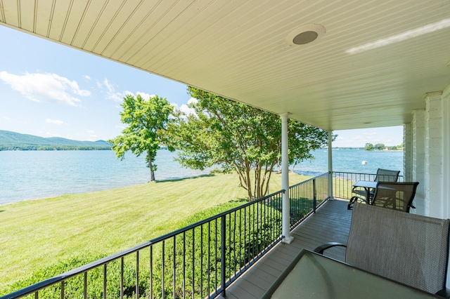 balcony featuring a water view