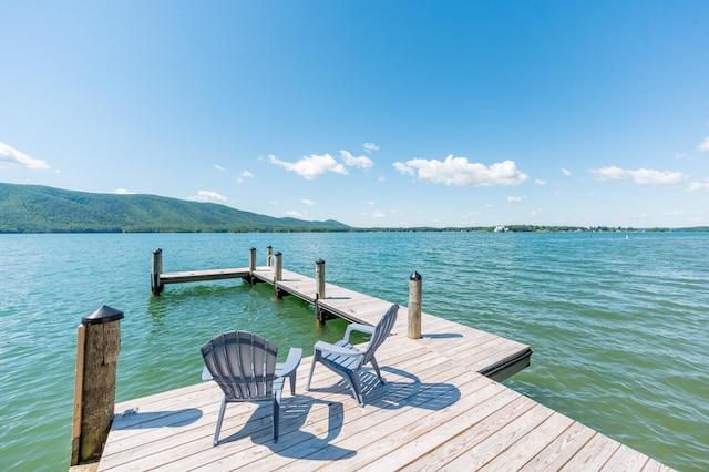 dock area with a water and mountain view