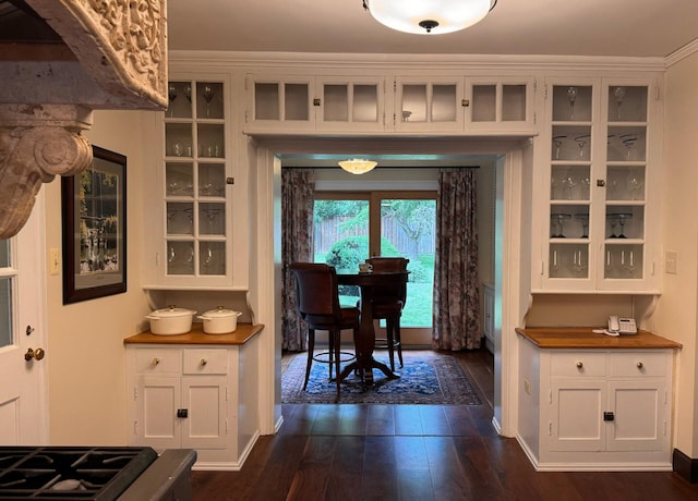 dining space with dark hardwood / wood-style flooring