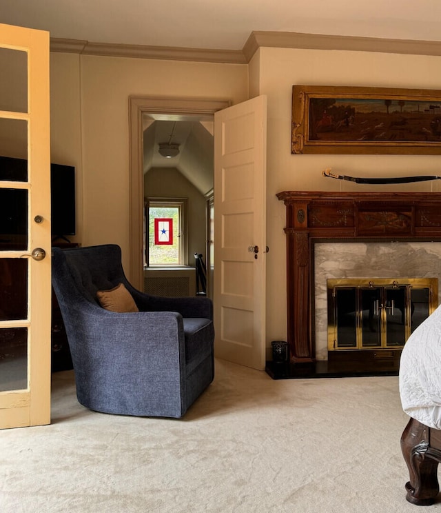 living room with ornamental molding, carpet floors, and lofted ceiling