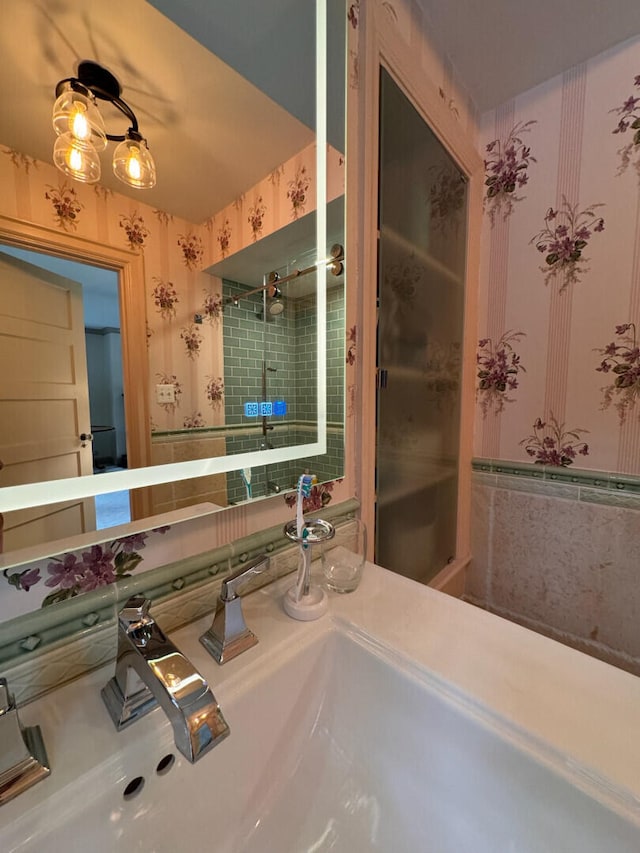 bathroom featuring vanity and a tile shower