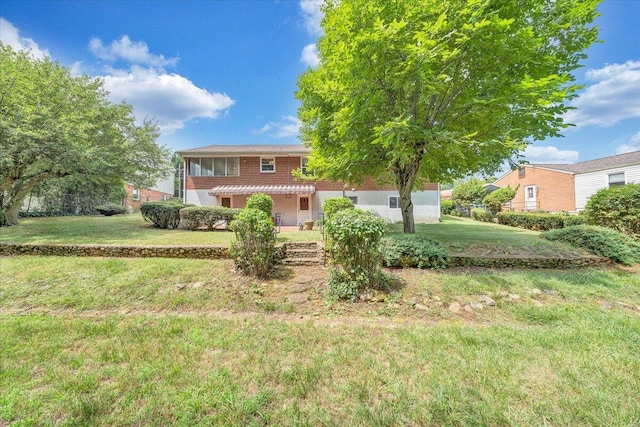 view of front of house with a front lawn