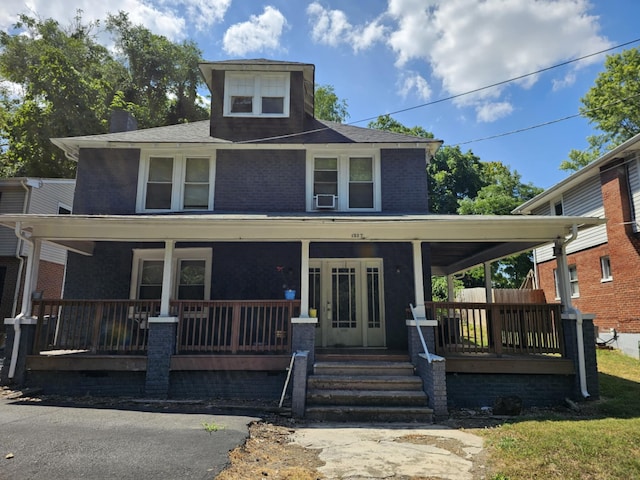 view of front of house featuring a porch and cooling unit