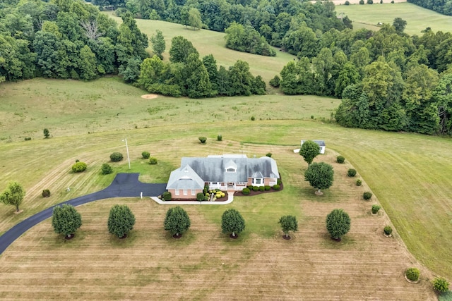 view of front of home with covered porch and a front yard