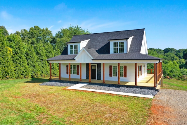 view of front of property featuring a porch and a front lawn