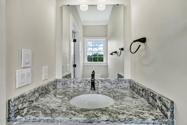 bathroom with vanity and toilet