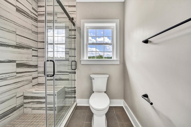 bathroom with toilet and walk in shower