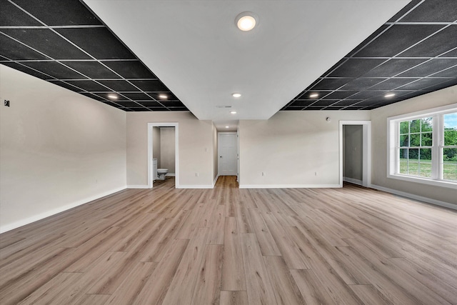 unfurnished living room with light hardwood / wood-style floors