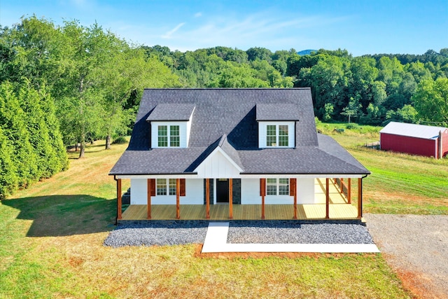 view of front of property with a front lawn and covered porch