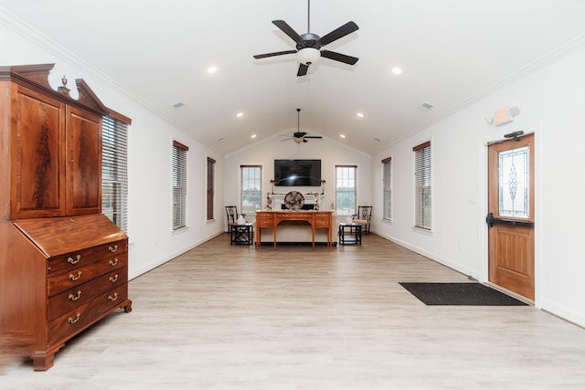 interior space with ornamental molding, light wood-type flooring, ceiling fan, and lofted ceiling