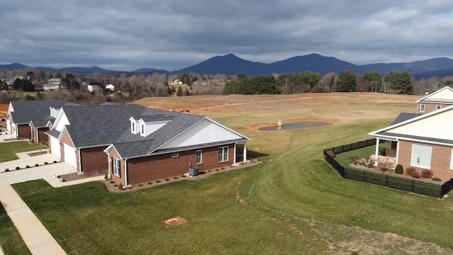 birds eye view of property with a mountain view