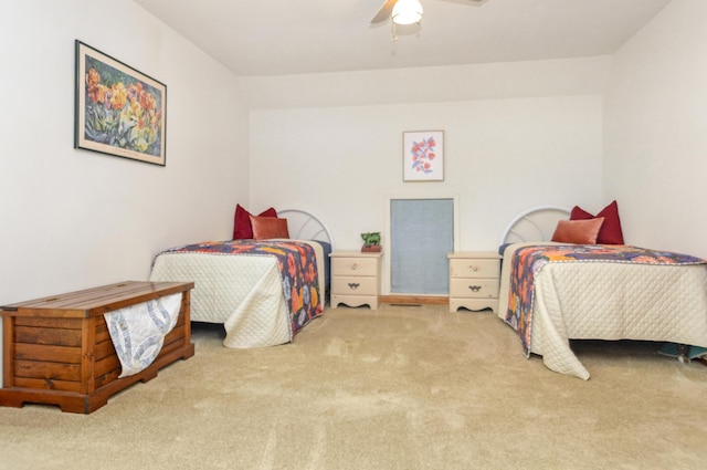 bedroom with a ceiling fan and carpet