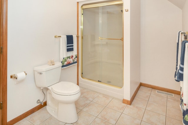 bathroom with a stall shower, visible vents, baseboards, toilet, and tile patterned flooring