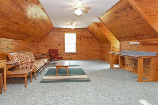 unfurnished room with wooden walls, lofted ceiling, wood ceiling, ceiling fan, and carpet