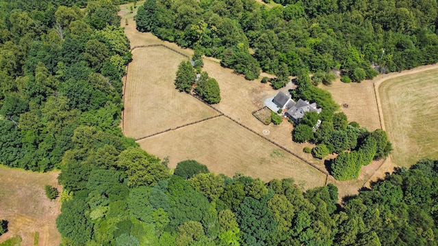 drone / aerial view featuring a rural view and a forest view